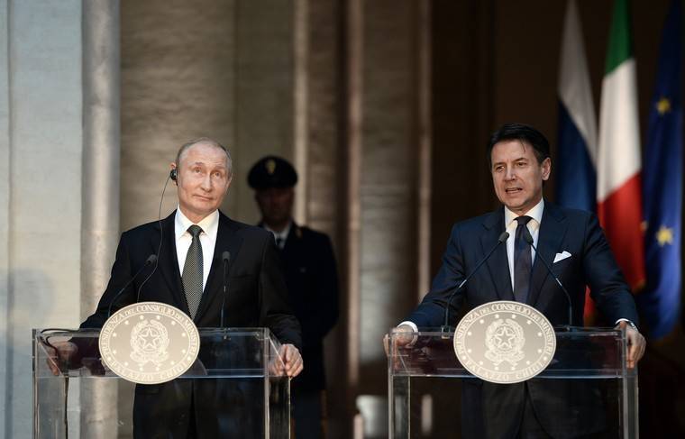 Путин поговорил с итальянским премьером о Ливии - news.ru - Италия - Берлин
