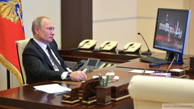 Владимир Путин - Путин: пандемия несет риски для национальных валют - riafan.ru - Москва - Россия