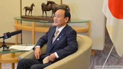 Есихидэ Суги - Японскому премьеру пришлось извиниться за ужин в большой компании - riafan.ru - Токио - Япония