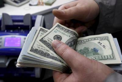 За первые пять минут торгов курс доллара США понизился до 71,094 руб. - smartmoney.one - США - Reuters