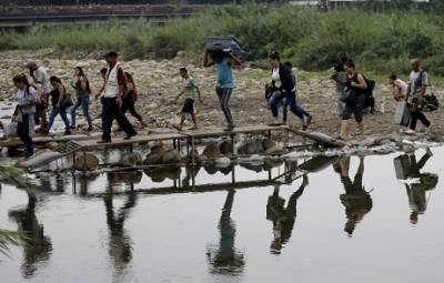 Иван Дук - Колумбия легализует сотни тысяч венесуэльских мигрантов, — Associated Press - enovosty.com - Колумбия - Венесуэла