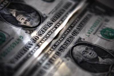 За первые пять минут торгов курс доллара США понизился до 73,3396 руб. - smartmoney.one - Reuters