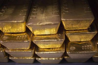 Фьючерсы на золото подешевели во время азиатских торгов - smartmoney.one - Reuters