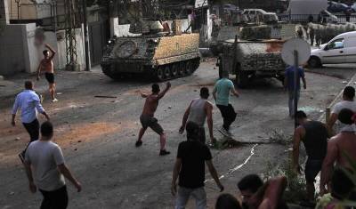 Саад Харири - На севере Ливана 15 человек пострадали от столкновений демонстрантов с военными - newizv.ru - США - Ливан