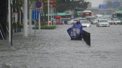 Как минимум 33 человека погибли в разрушительных наводнениях в Китае - usa.one - Китай