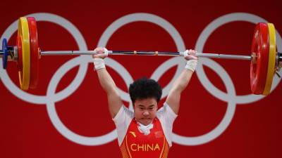 Китайская штангистка Чжихуэй завоевала золото на ОИ в Токио - russian.rt.com - Токио - Индия - Индонезия