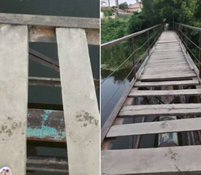 На Черкасчине люди ежедневно рискуют провалиться в реку через пропасть в аварийном мосту - lenta.ua - Украина
