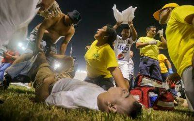 В результате давки на футбольном стадионе в Сальвадоре погибли не менее 12 человек - obzor.lt - Сан-Сальвадор