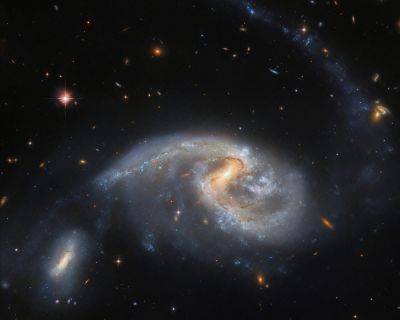 Звездный мост: Hubble сфотографировал взаимодействующие галактики - universemagazine.com